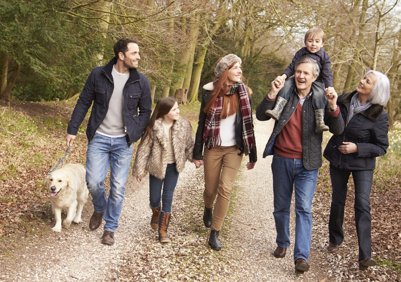 A family walking together on a forest trail